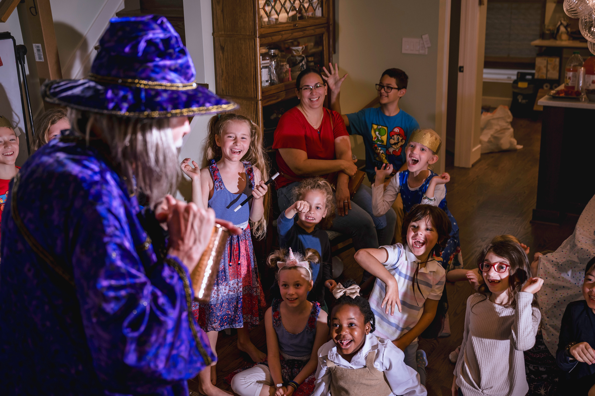 Drew Owen, as Professor Fizzwiffle the wizard, entertains at a birthday party